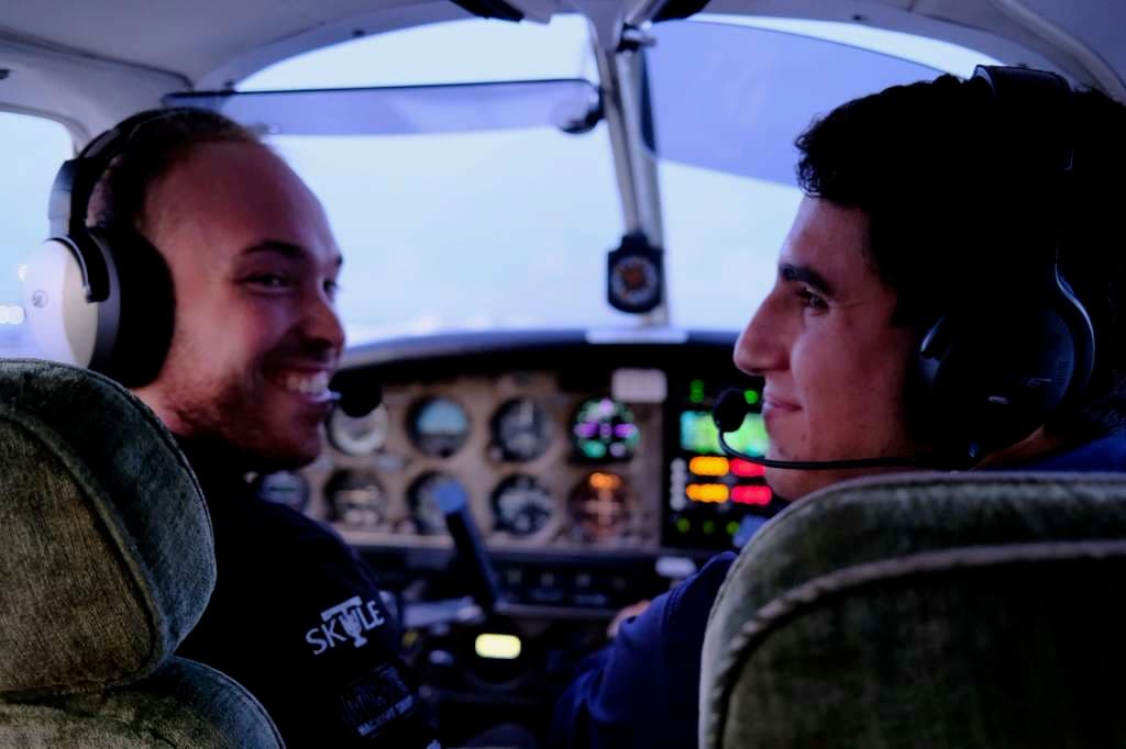 Instructor and student pilot in cockpit
