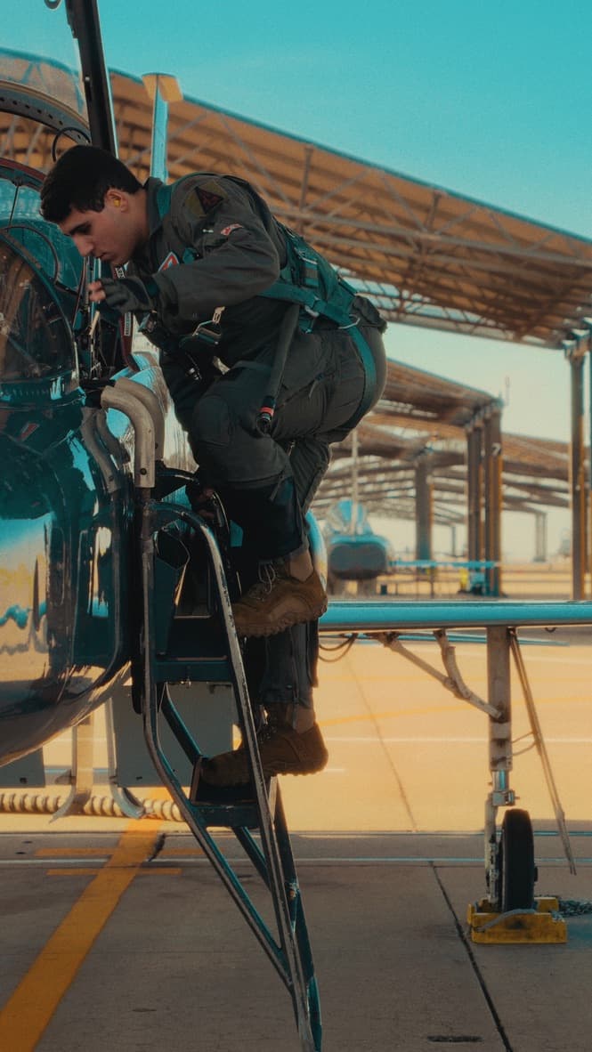 Grayson boarding a military aircraft